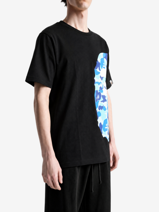 Black t-shirt worn by a person, showing the t-shirt fit