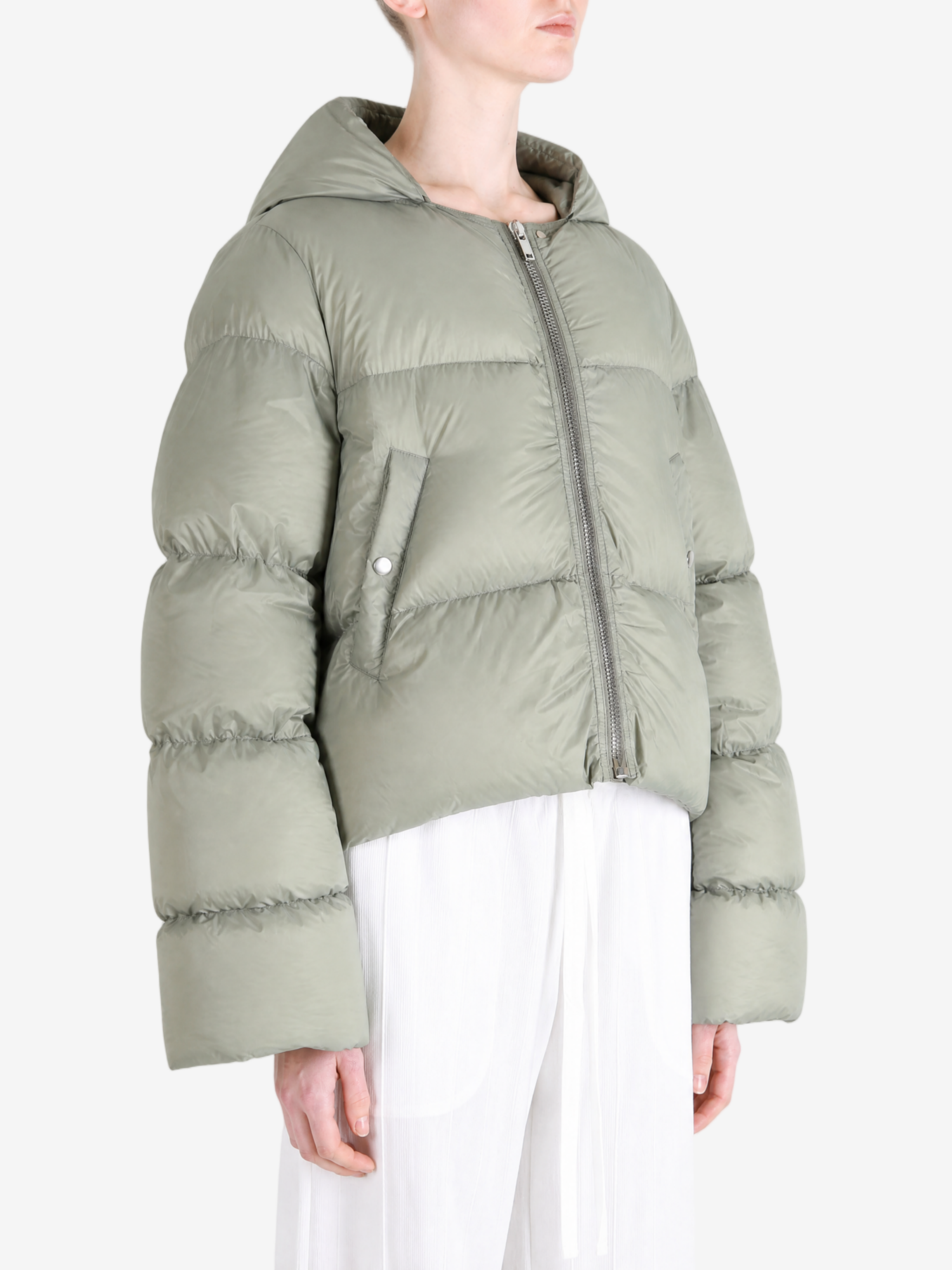 Green jacket worn by a person, showing the jacket fit