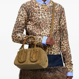 Tan bag worn by a person, showing the bag fit