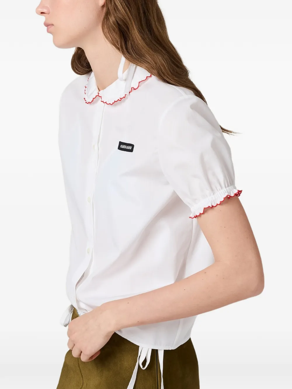 White shirt worn by a person, showing the shirt fit