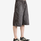 Grey shorts worn by a person, showing the shorts fit