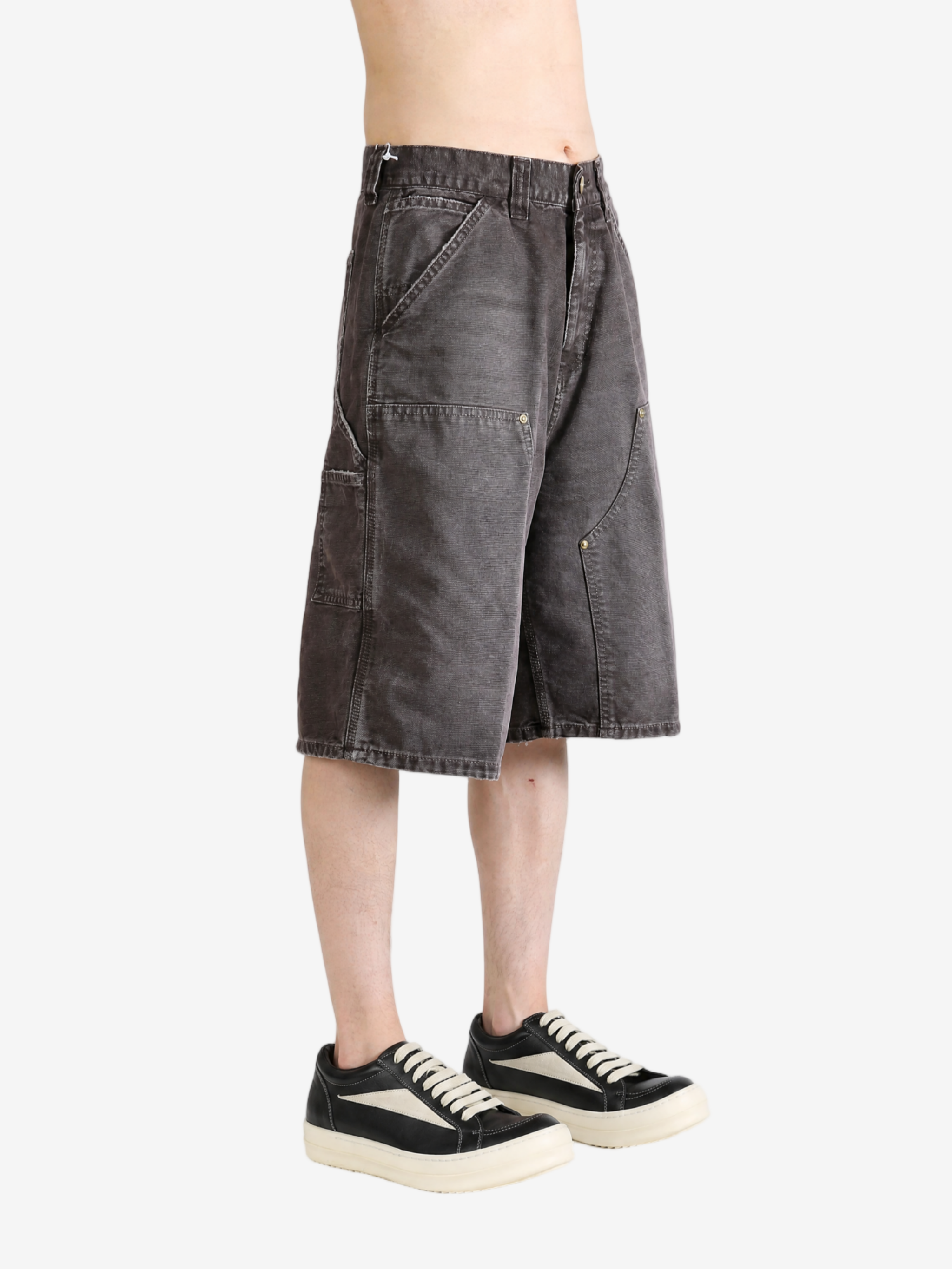 Grey shorts worn by a person, showing the shorts fit