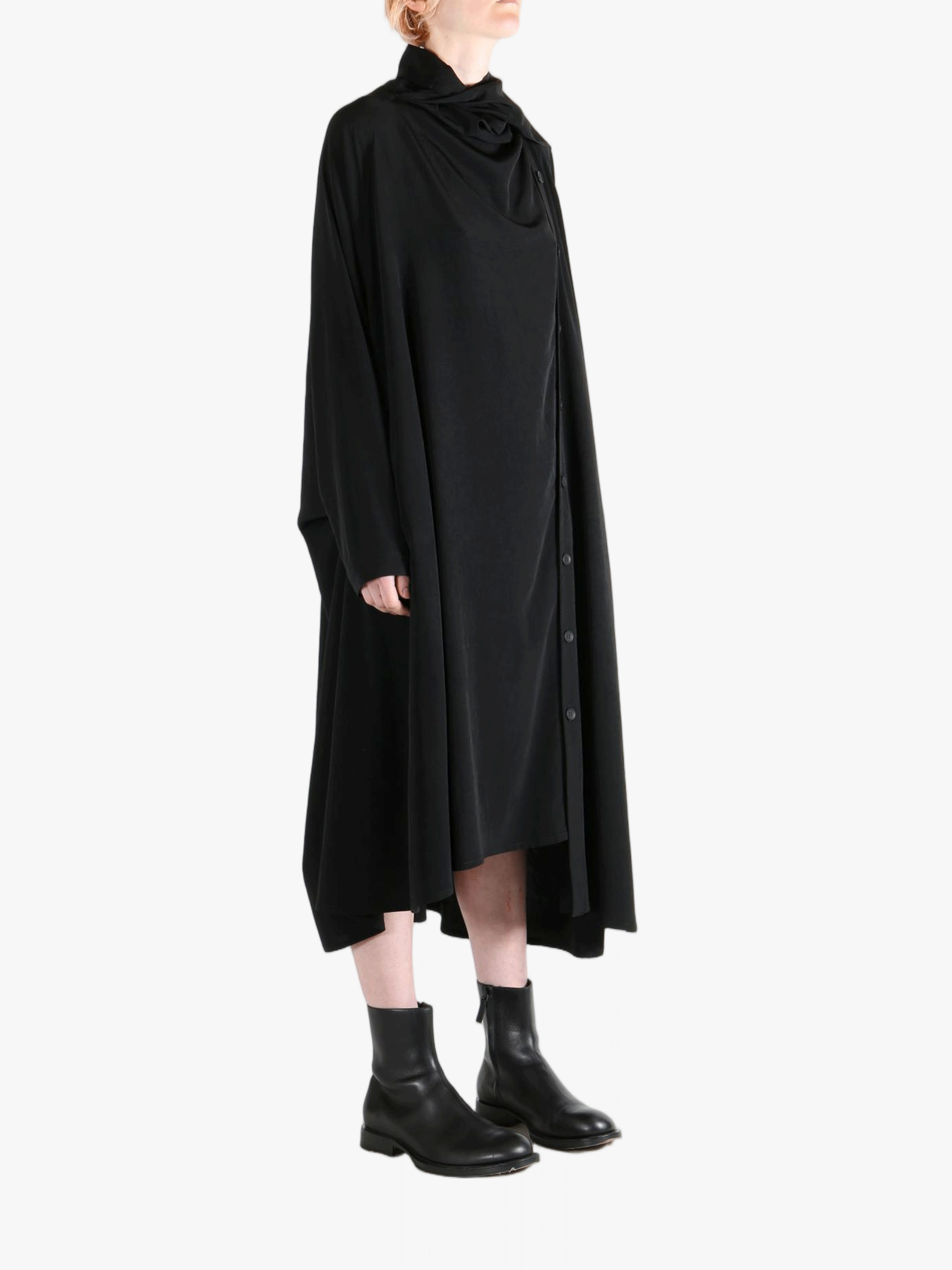 Black dress worn by a person, showing the dress' fit