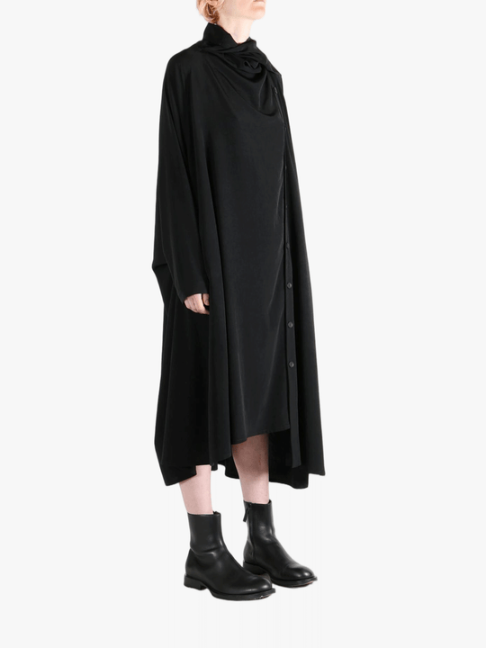 Black dress worn by a person, showing the dress' fit