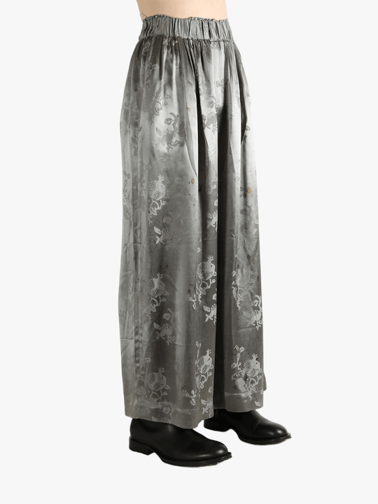 Grey pants worn by a person, showing the pants' fit