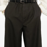 Close up of black pants, showing texture of the cotton fabric