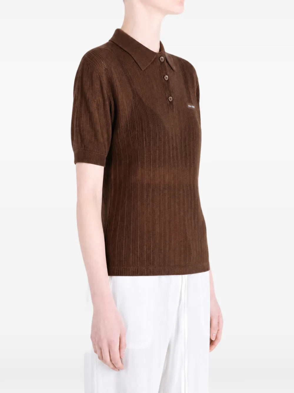 Brown shirt worn by a person, showing the shirt fit