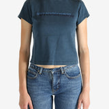 Blue t-shirt worn by a person, showing the shirt's fit