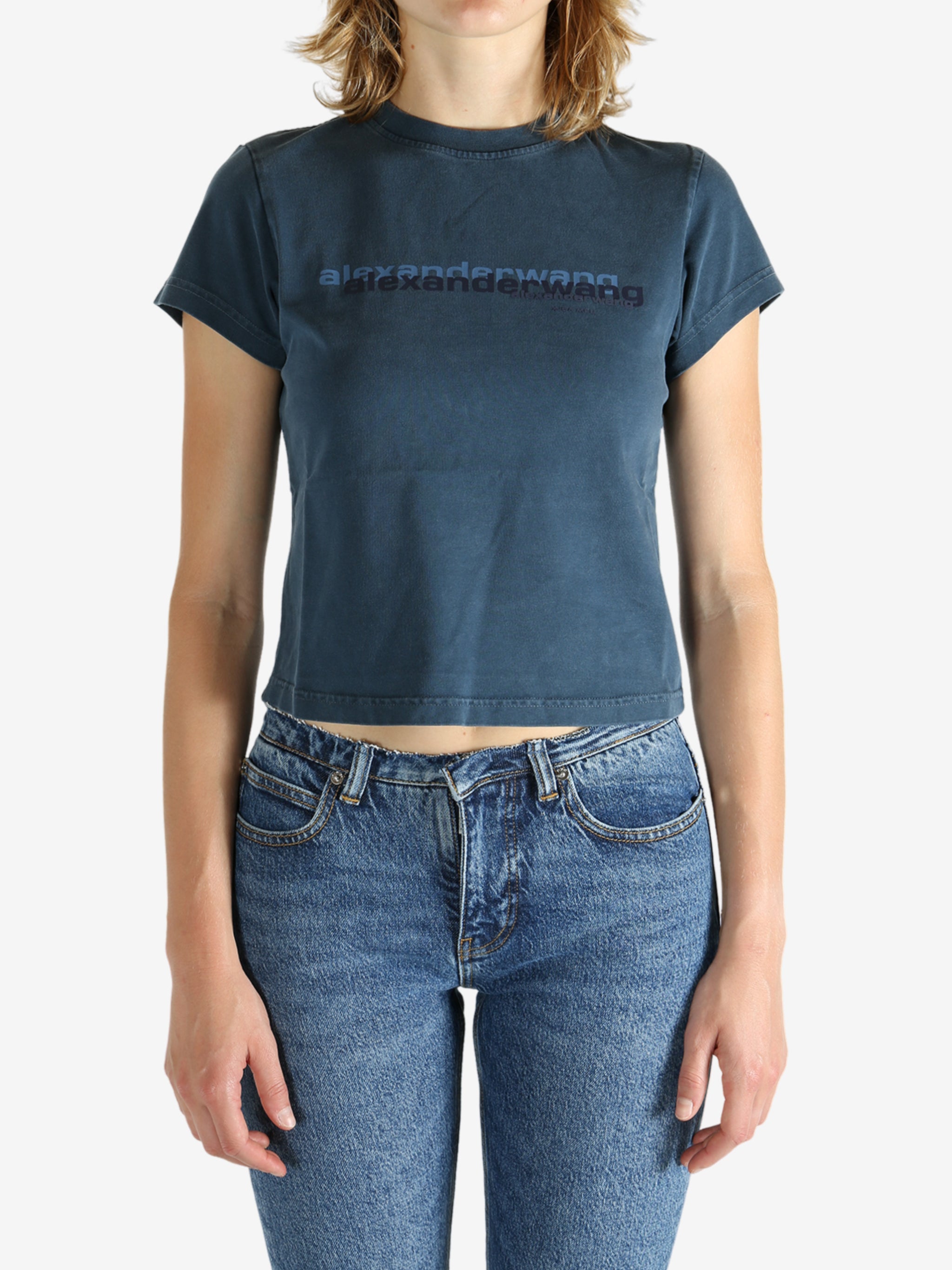 Blue t-shirt worn by a person, showing the shirt's fit