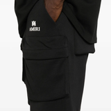 Close up of black shorts, showing texture of the Polyester and Cotton fabric