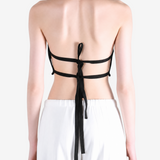 Black top worn by a person, showing the top fit