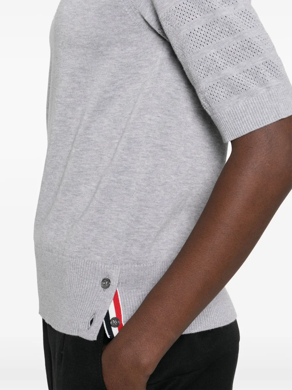 Close up of grey t-shirt, showing texture of the cotton fabric