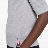 Close up of grey t-shirt, showing texture of the cotton fabric