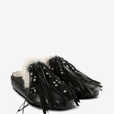 Black mules, side view