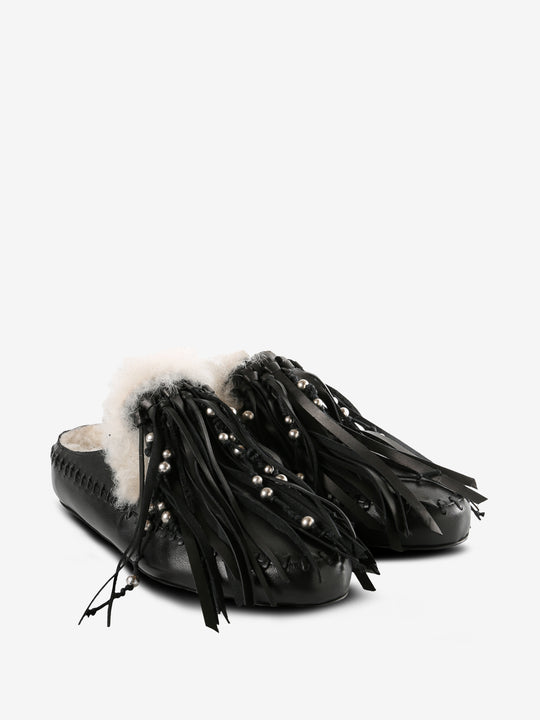 Black mules, side view