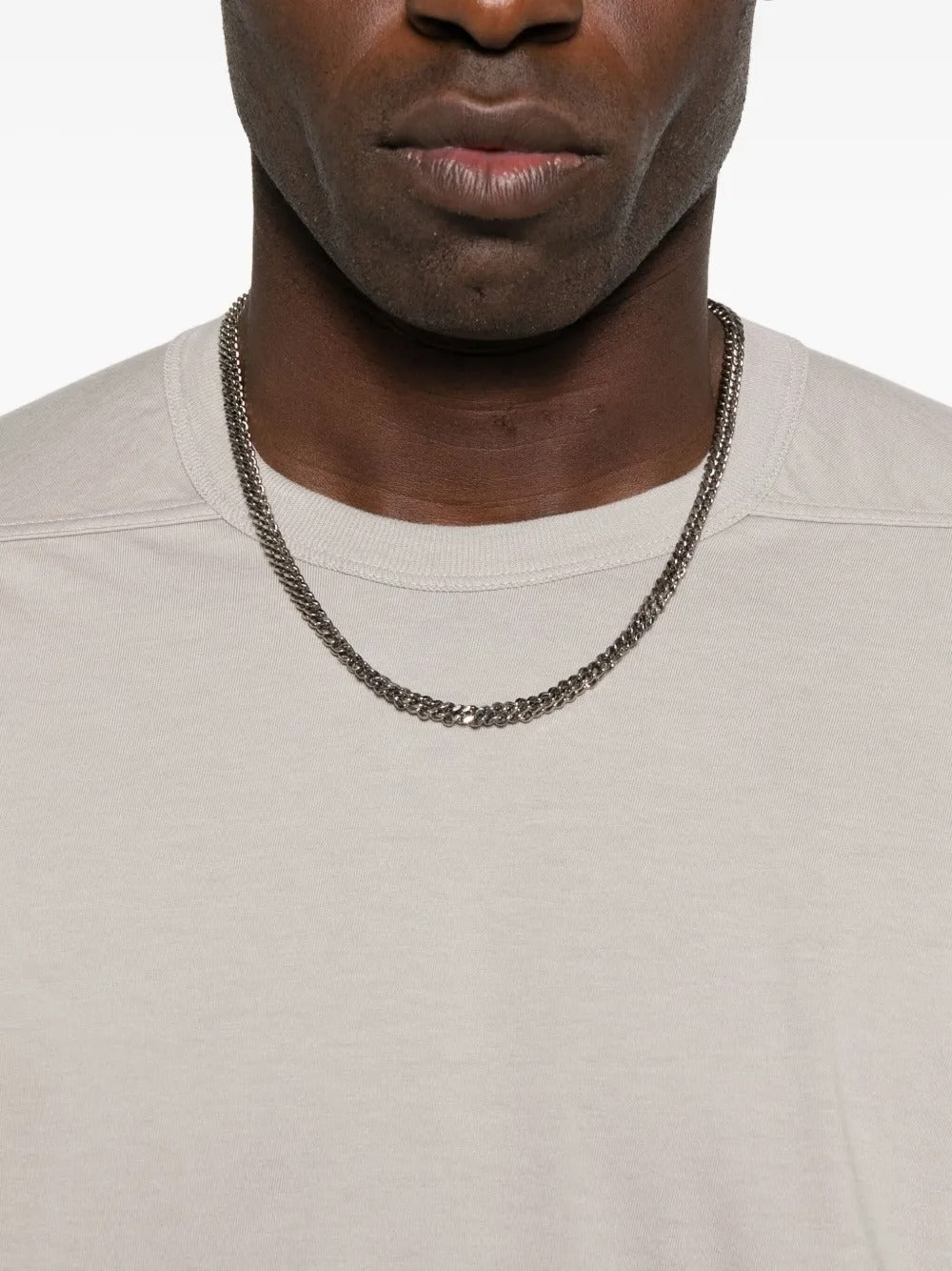 Close up of the white t-shirt, showing texture of the cotton fabric