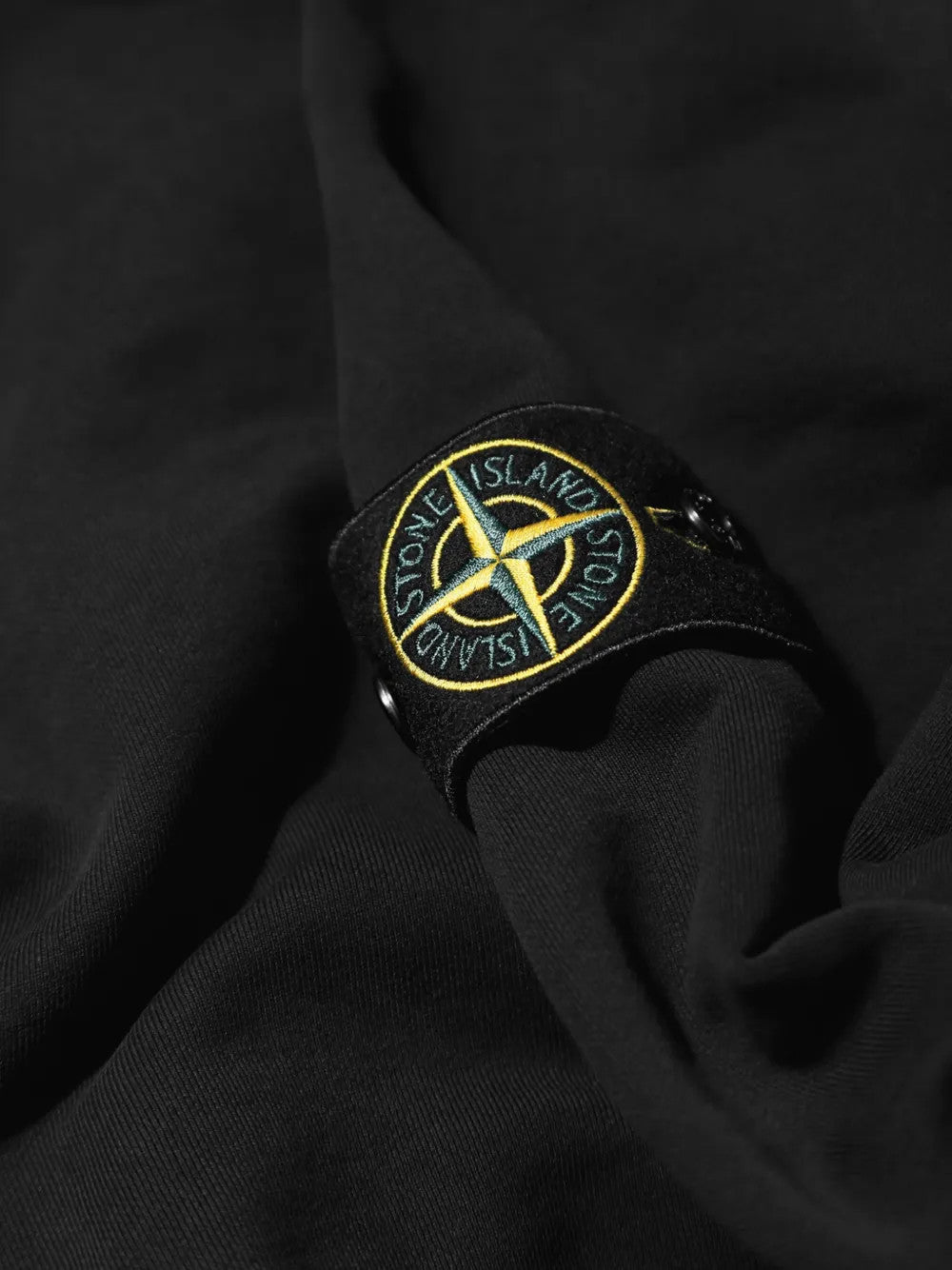 Close up of Black hoodie, showing texture of the 100% cotton fabric
