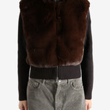 Brown sweater worn by a person, showing the sweater's fit