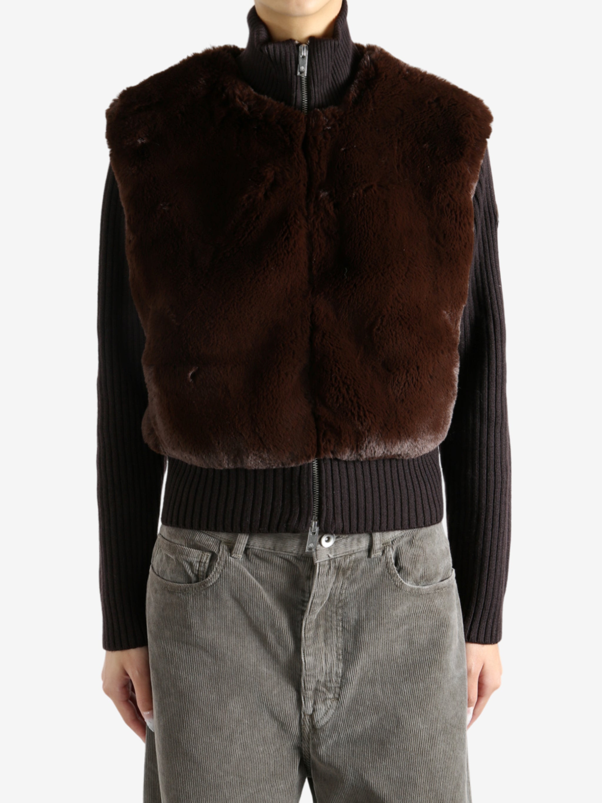 Brown sweater worn by a person, showing the sweater's fit