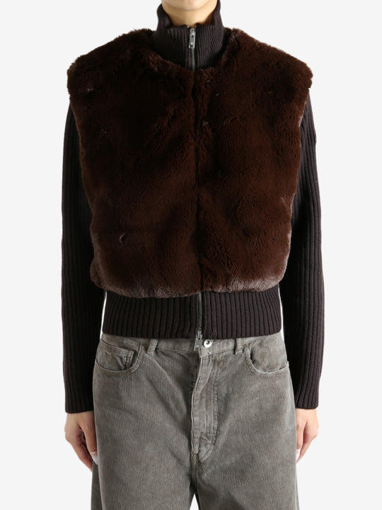 Brown sweater worn by a person, showing the sweater's fit