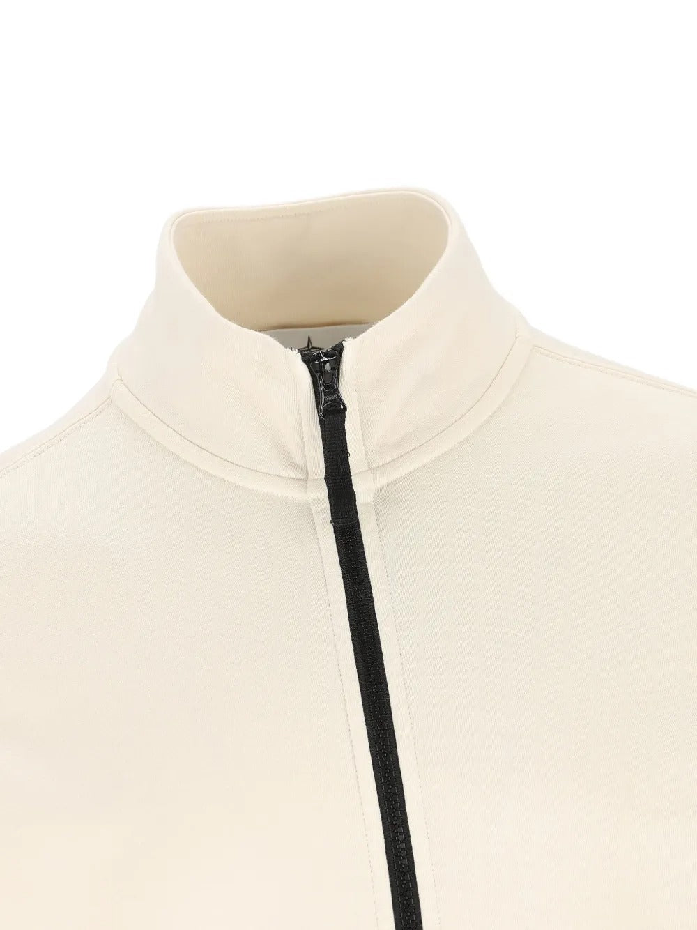 Close up of white jackets, showing texture of the cotton fabric