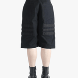 Black shorts worn by a person, showing the shorts's fit