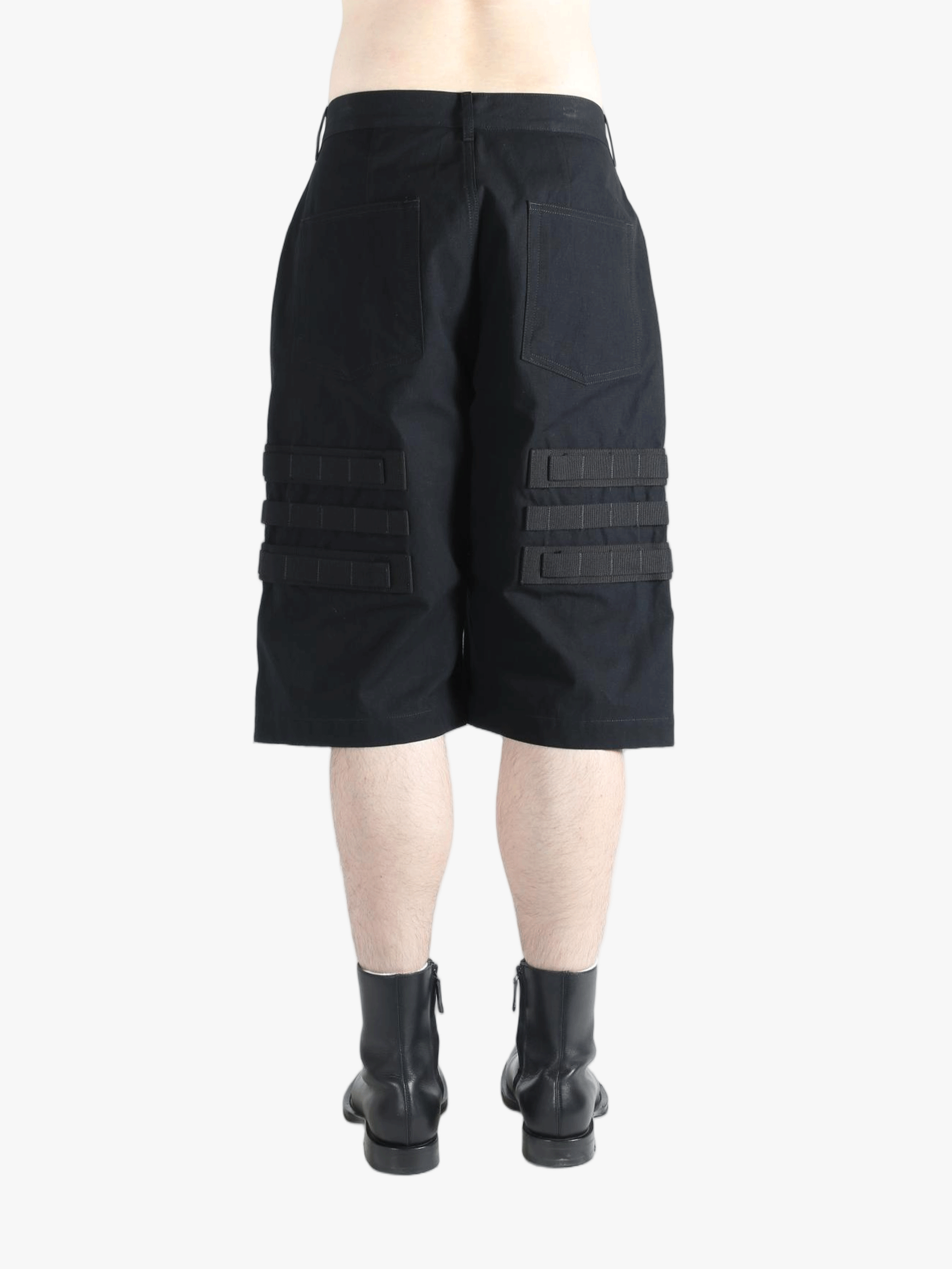 Black shorts worn by a person, showing the shorts's fit