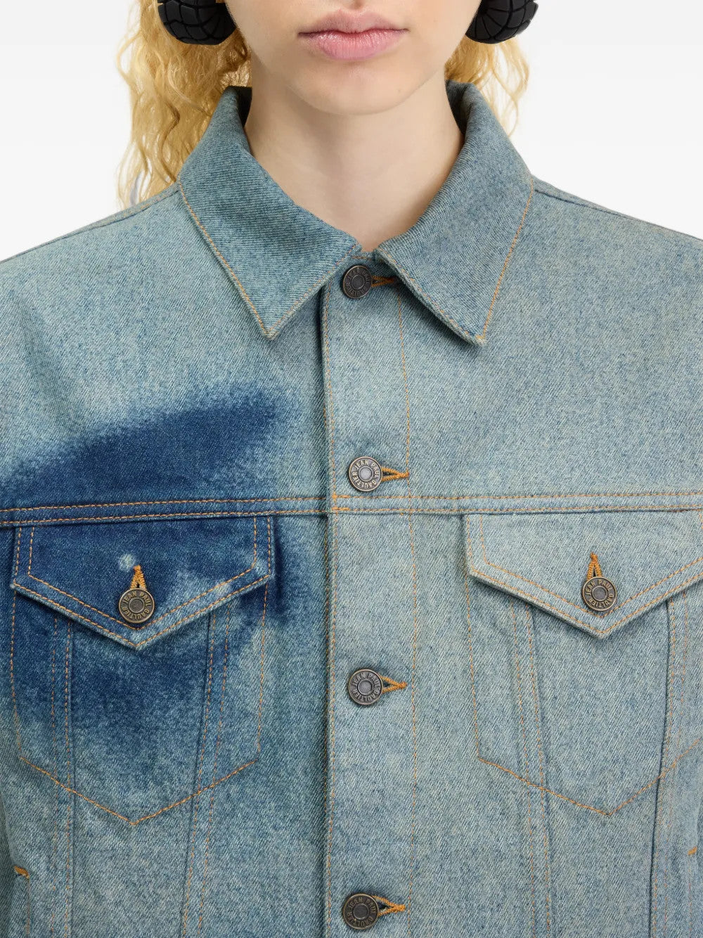 Blue jacket worn by a person, showing the jacket fit