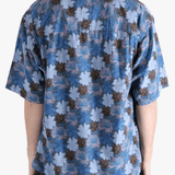 Navy shirt worn by a person, showing the shirt's fit