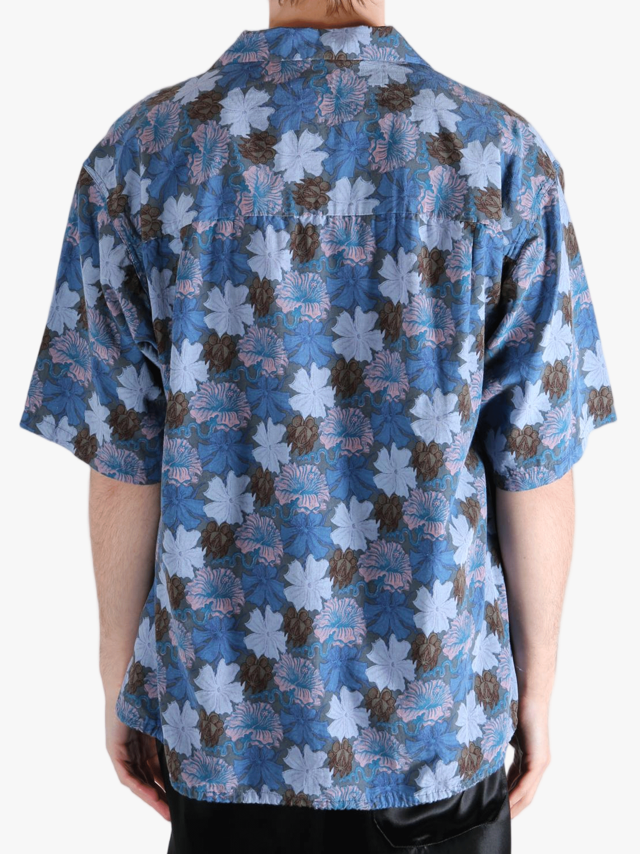 Navy shirt worn by a person, showing the shirt's fit