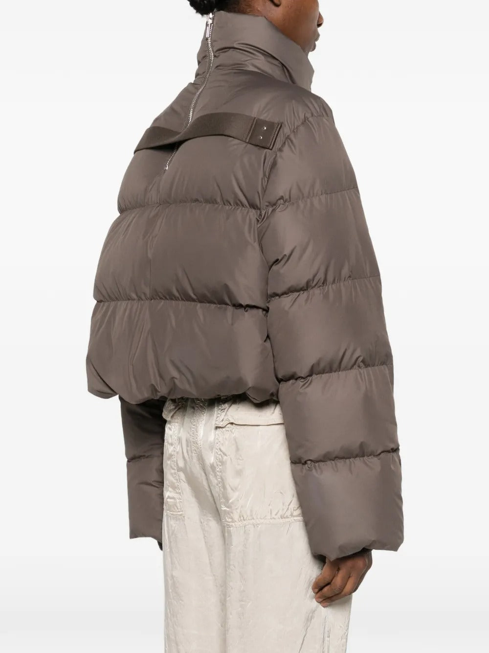 Brown jackets worn by a person, showing the jackets fit