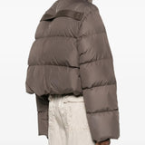 Brown jackets worn by a person, showing the jackets fit