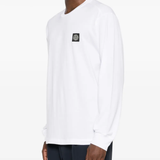 White t-shirt worn by a person, showing the shirt's fit