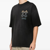 Black t-shirt worn by a person, showing the shirt' fit