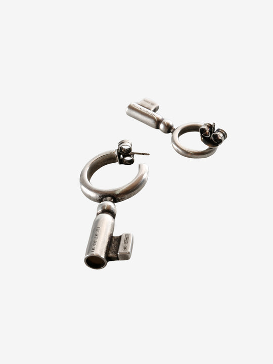 Close up of the grey earrings, showing texture of the silver fabric