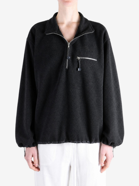 Black jacket worn by a person, showing the jacket fit