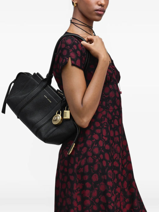 Black bag worn by a person, showing the bag fit