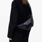 Black bag worn by a person, showing the bag fit