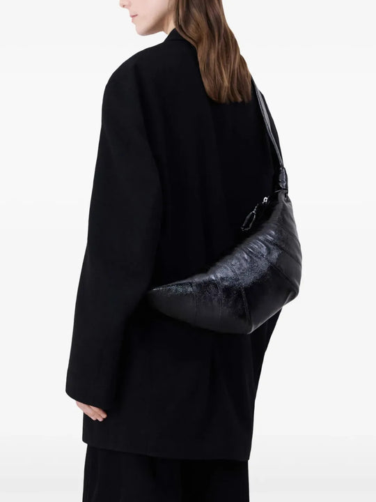 Black bag worn by a person, showing the bag fit