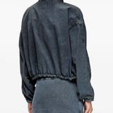 Black jacket worn by a person, showing the jacket's fit