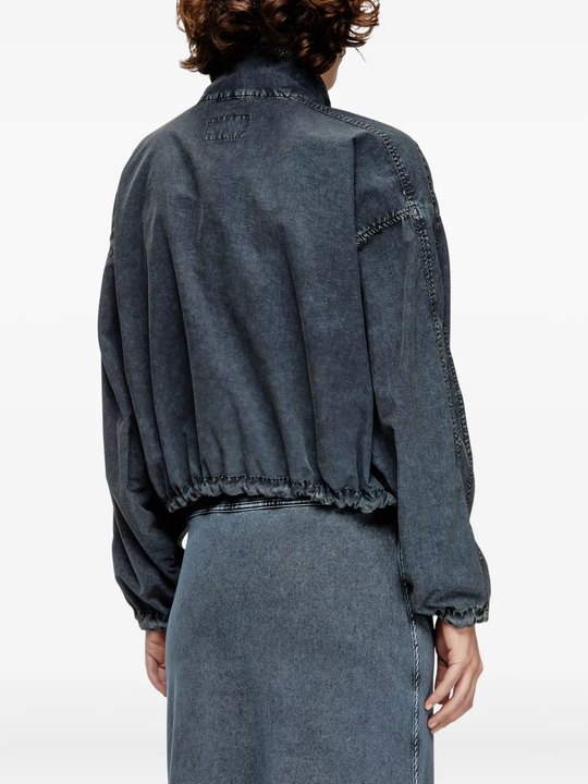 Black jacket worn by a person, showing the jacket's fit