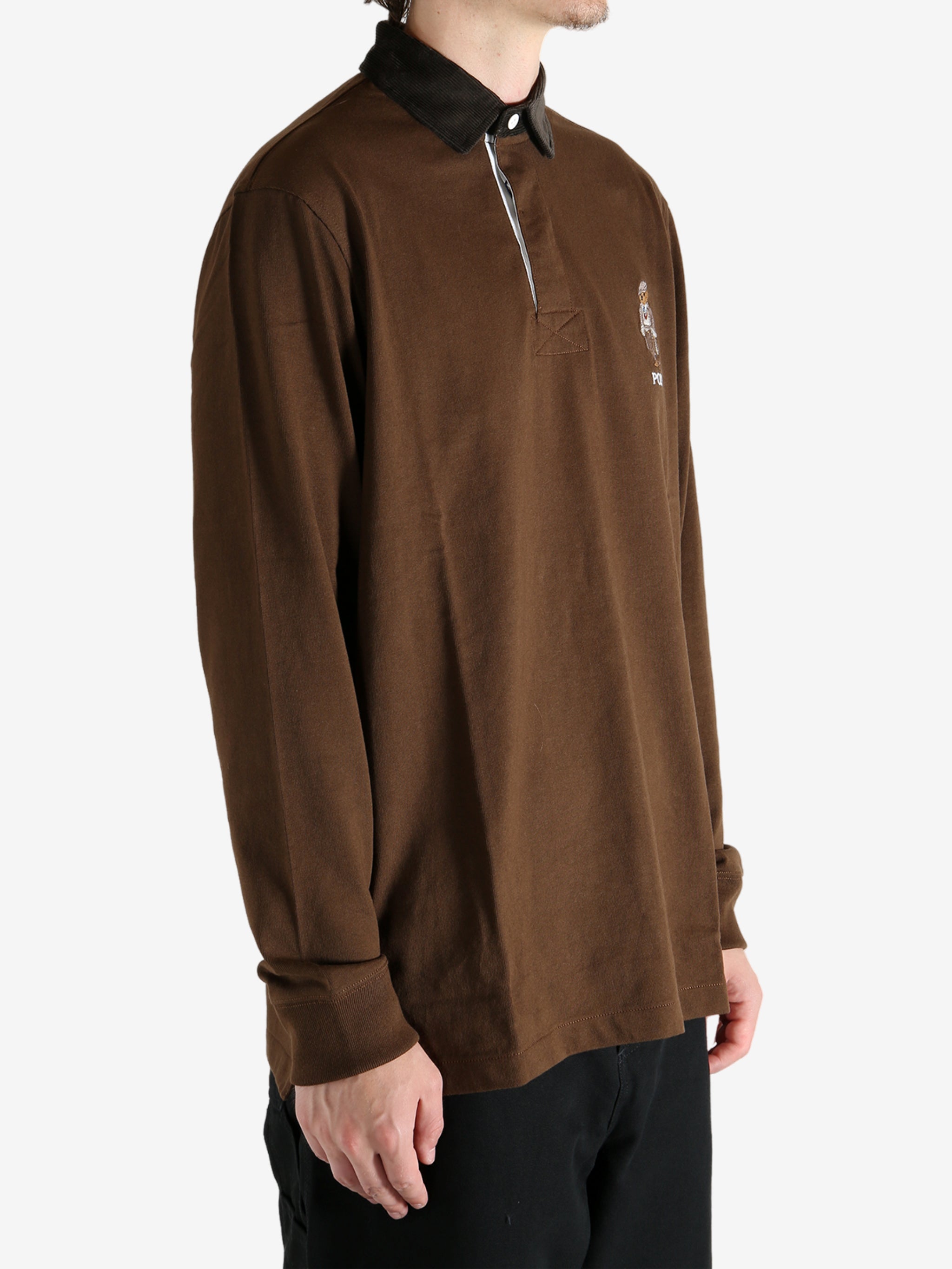 Brown shirt worn by a person, showing the shirt's fit