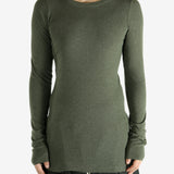 Green t-shirt worn by a person, showing the shirt's fit