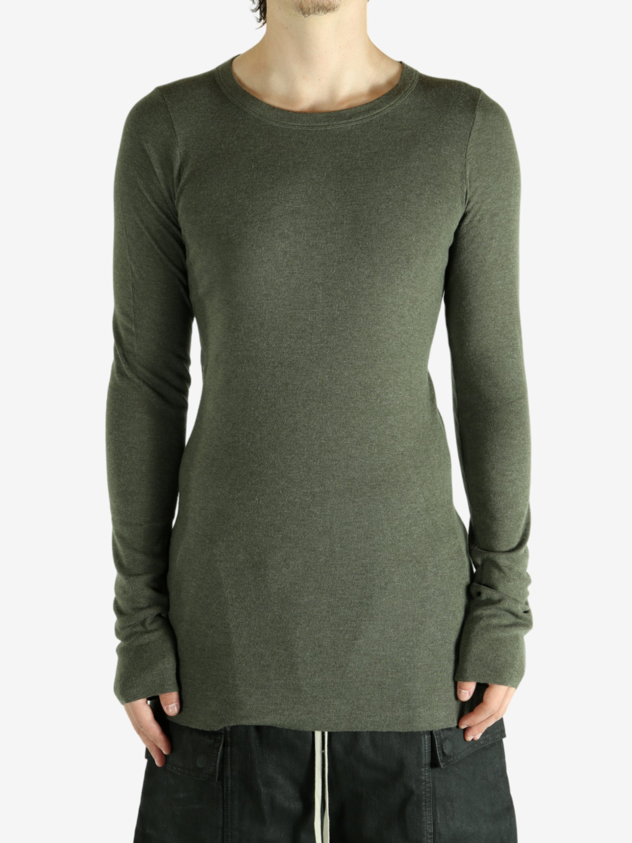 Green t-shirt worn by a person, showing the shirt's fit