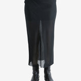 Black skirt worn by a person, shwing the skirt's fit