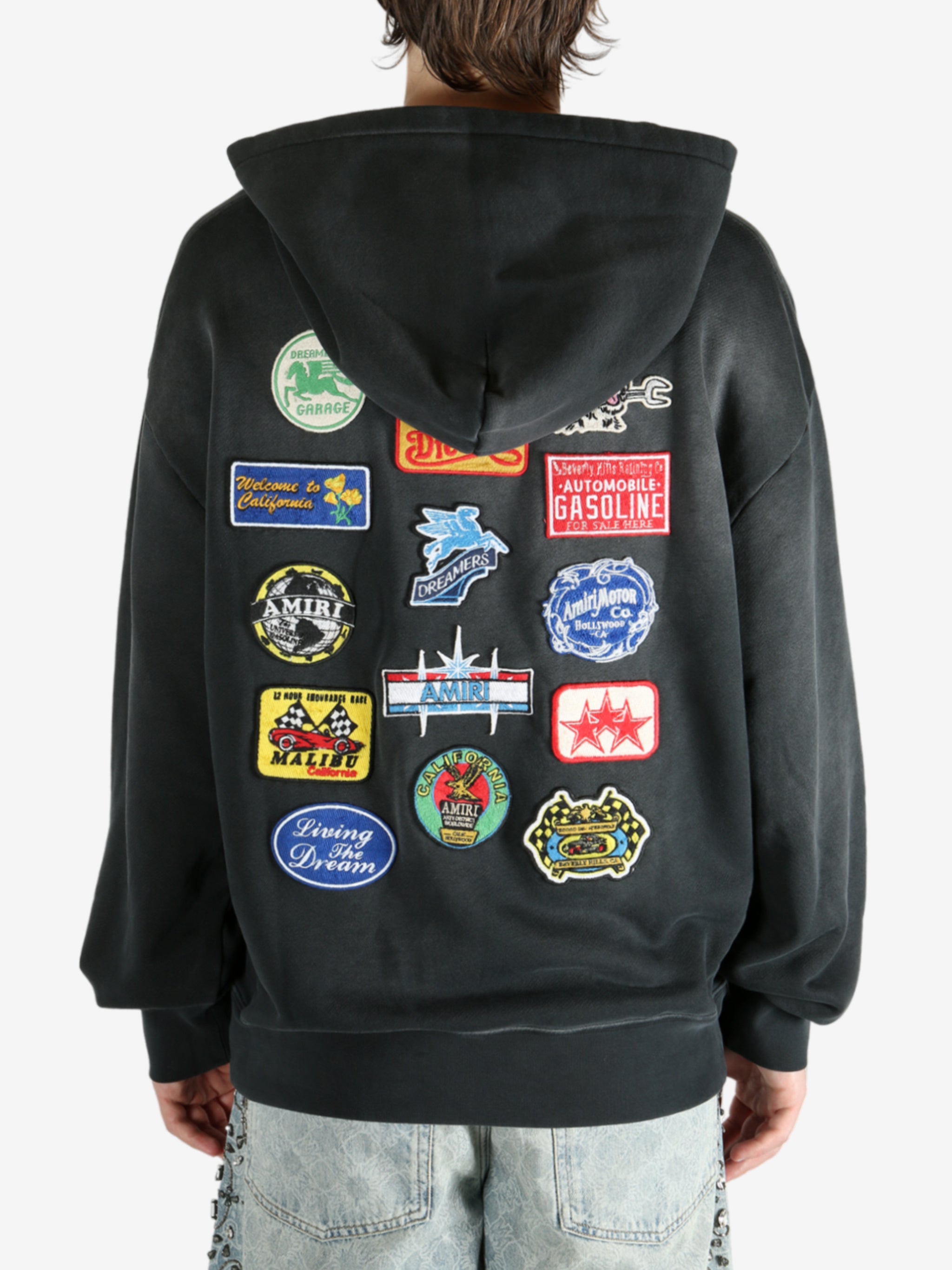 Black hoodie worn by a person, showing the hoodie’s fit