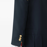 Close up of navy dress, showing texture of the Wool fabric