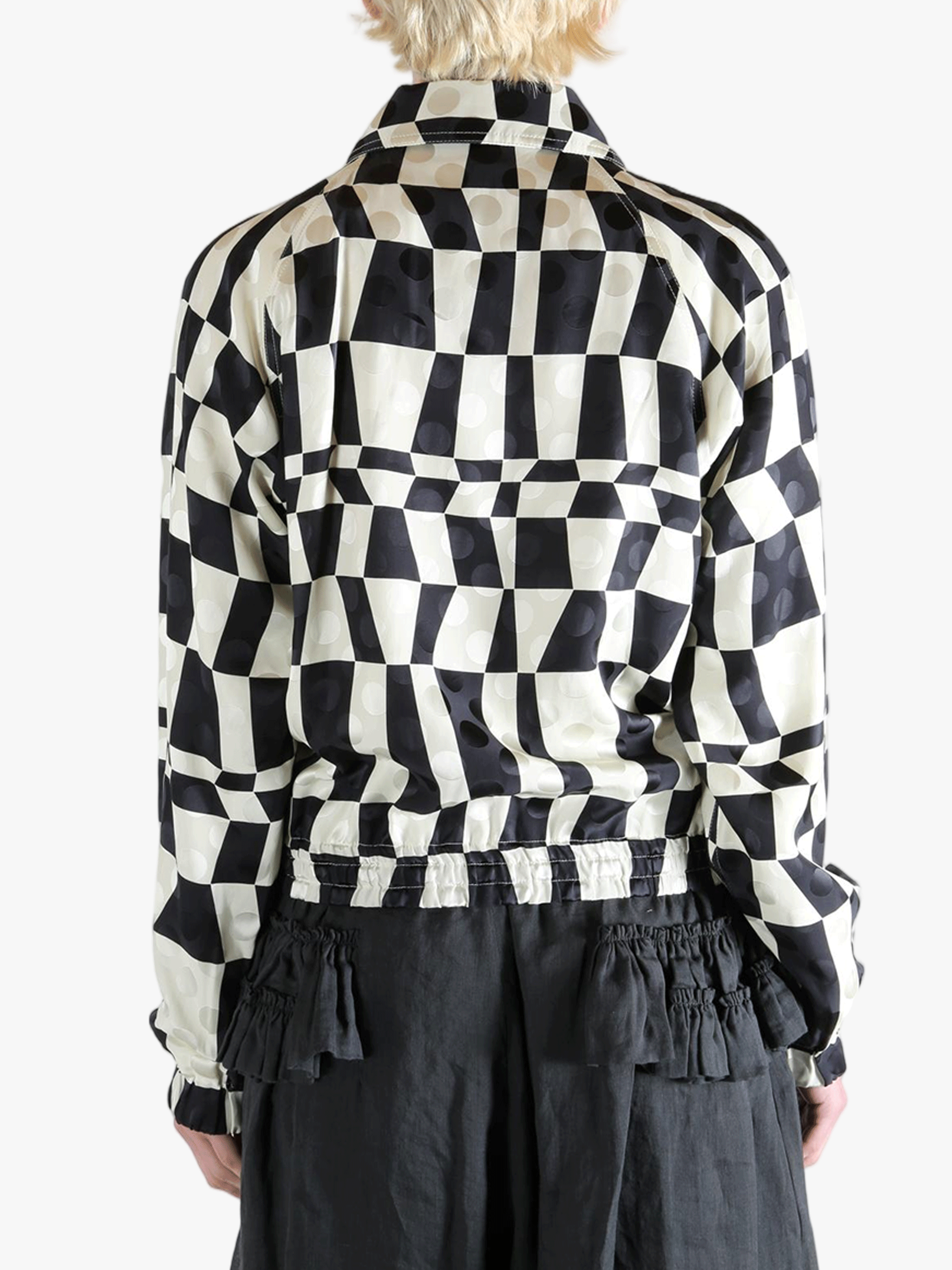 Black jacket worn by a person, showing the jacket's fit