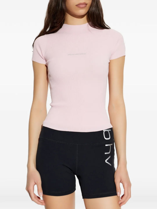 Pink t-shirt worn by a person, showing the t-shirt's fit