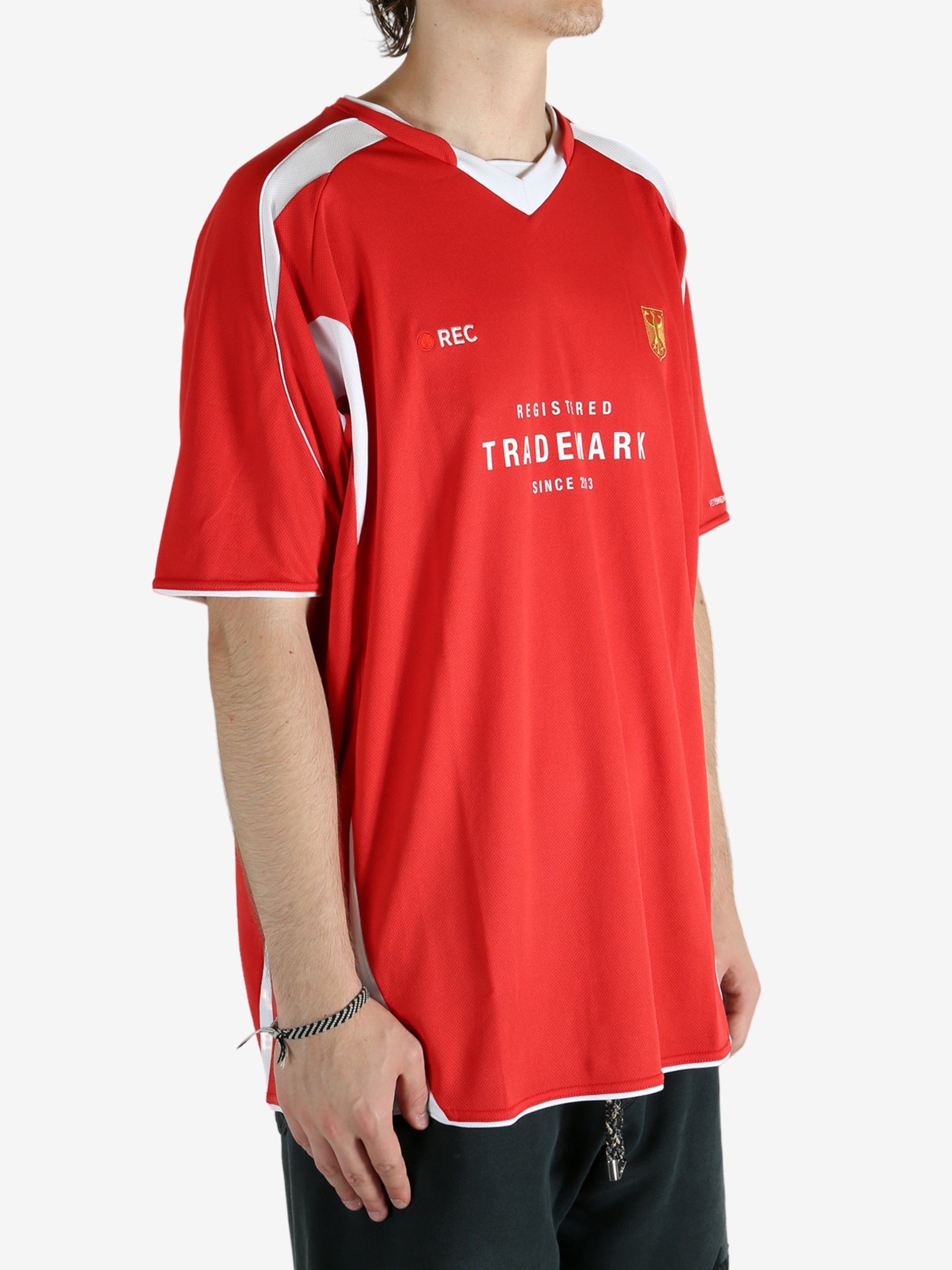 Red t-shirt worn by a person, showing the shirt's fit